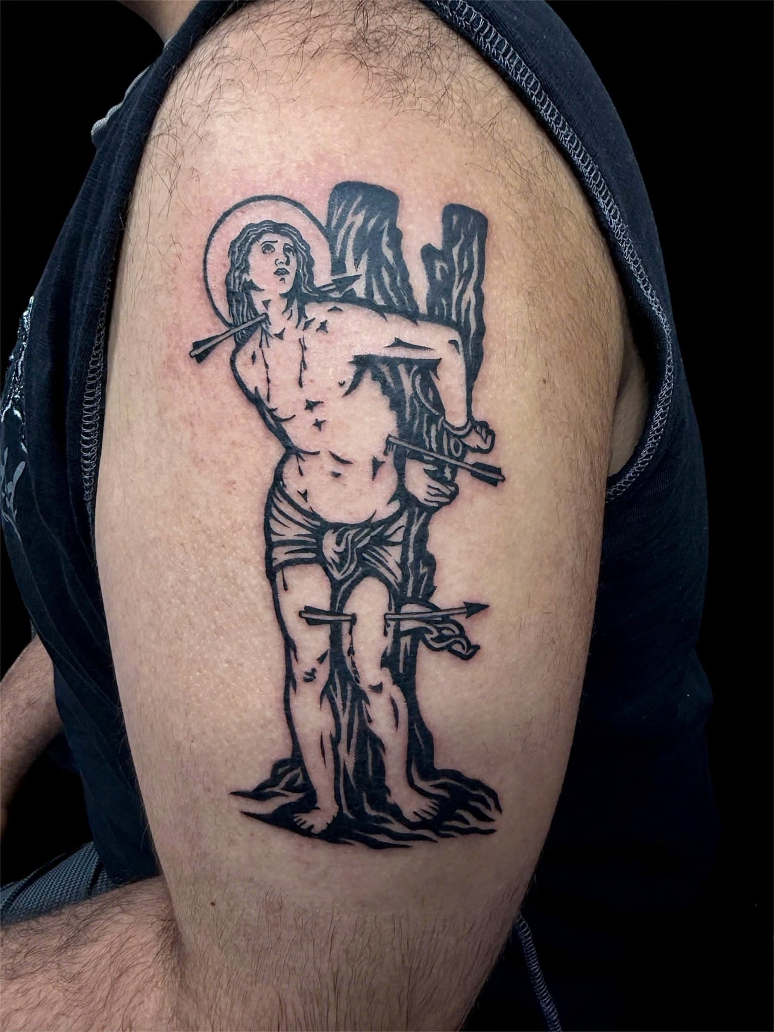 St Sebastian bold blackwork arm tattoo — Rae Ink Ho Chi Minh