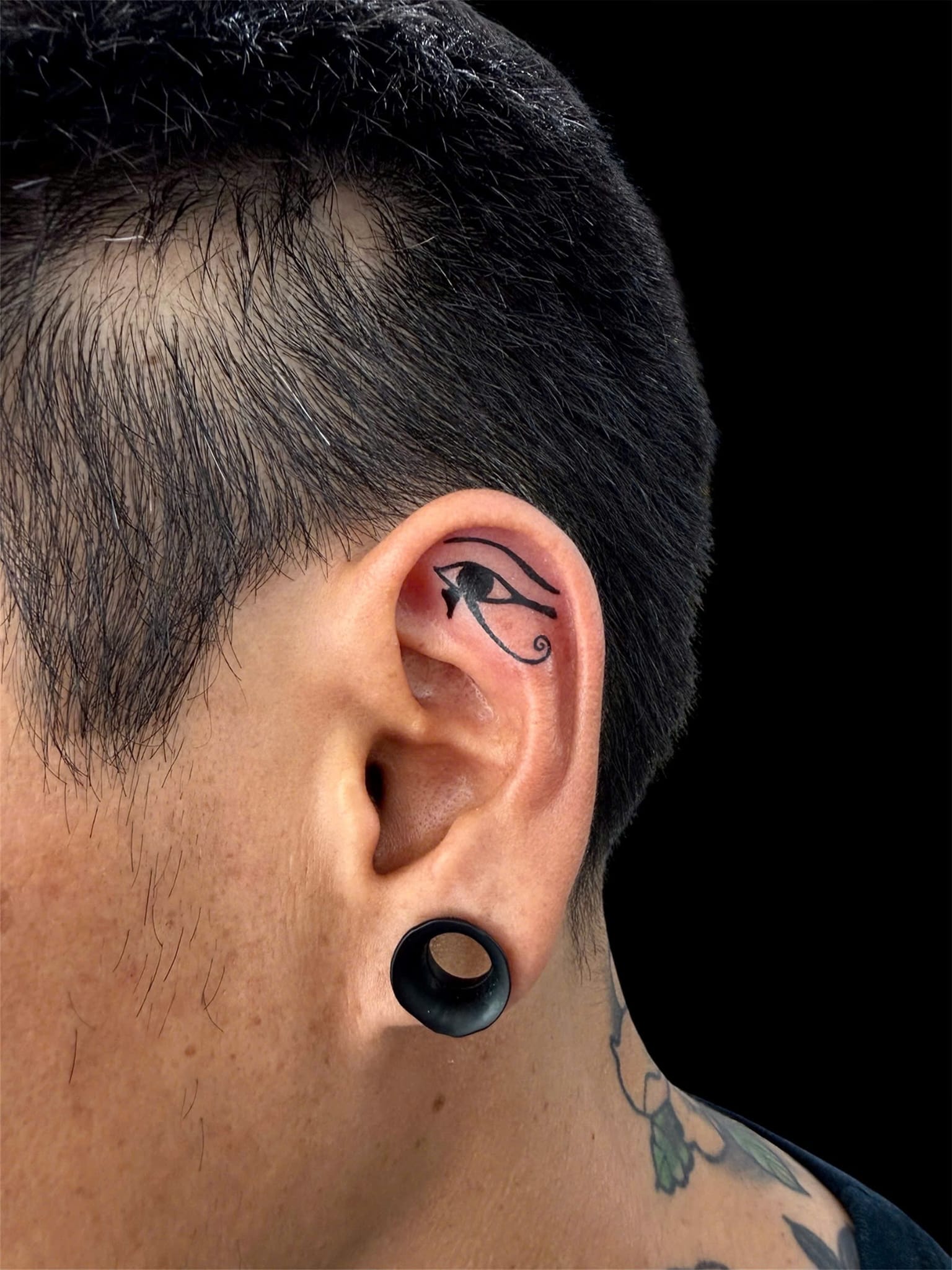 Eye of Horus ear tattoo fine line — Rae Ink Saigon