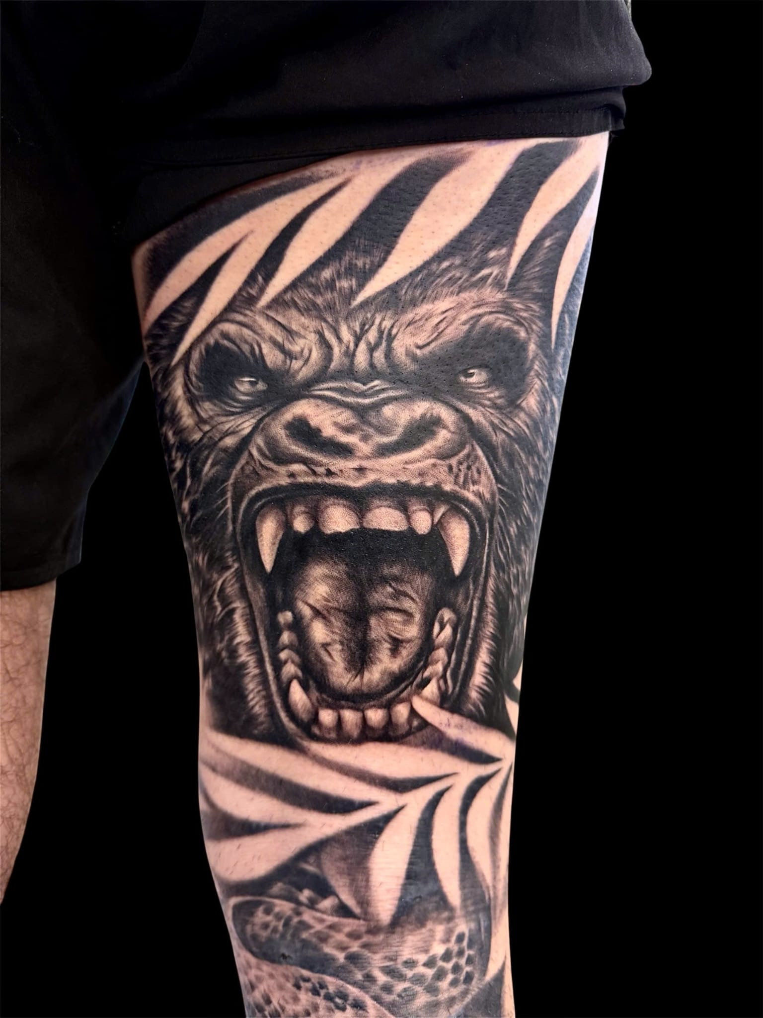 Black and grey realism roaring gorilla thigh tattoo — Rae Ink Saigon