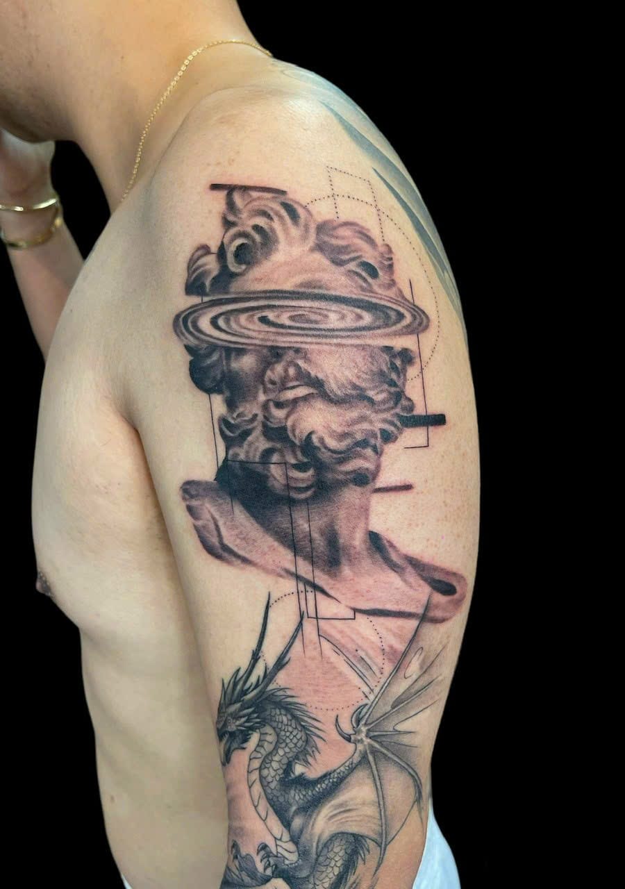 Classical bust with galaxy ring and dragon shoulder tattoo — Rae Ink Saigon