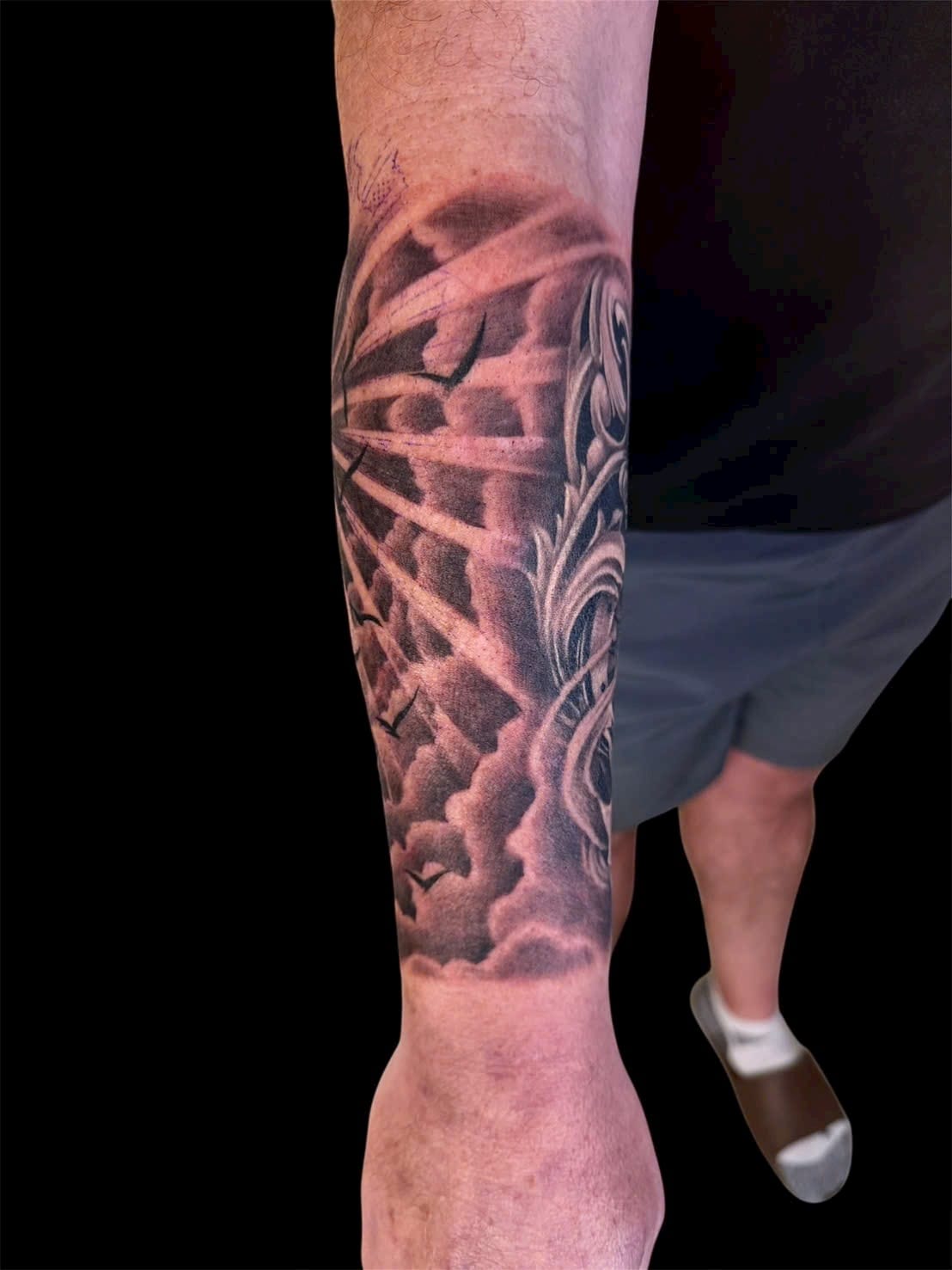 Clouds, birds and ornamental forearm sleeve tattoo — Rae Ink Saigon