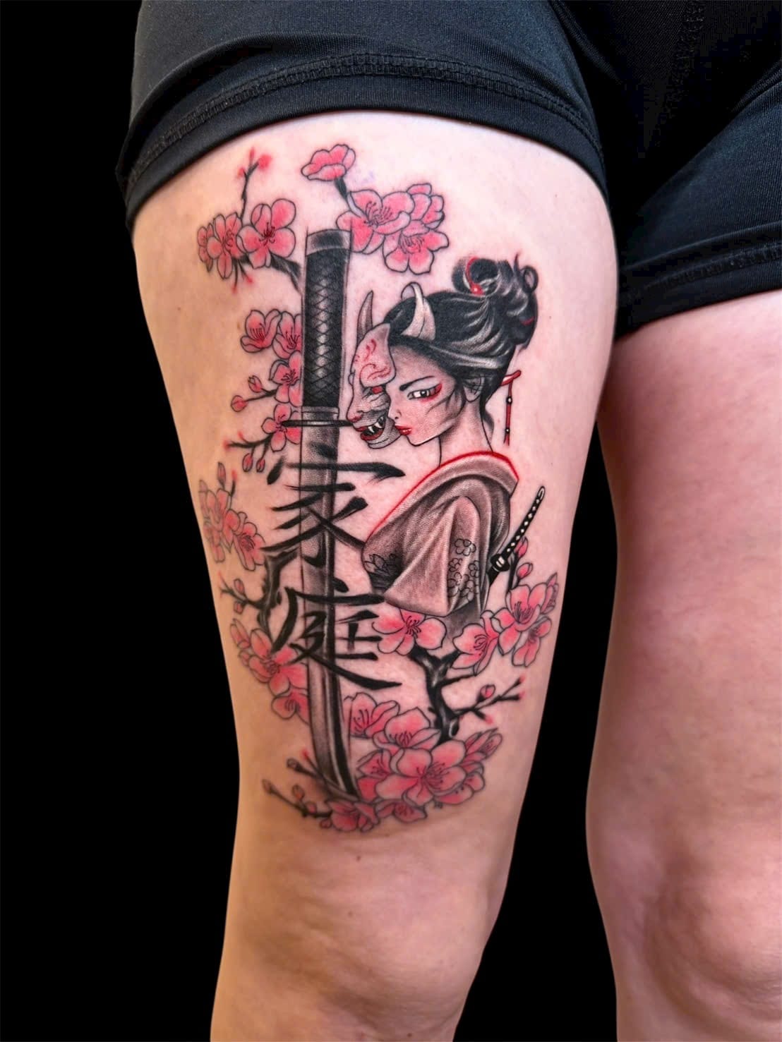 Geisha with hannya mask, katana and cherry blossom thigh tattoo — Rae Ink Saigon