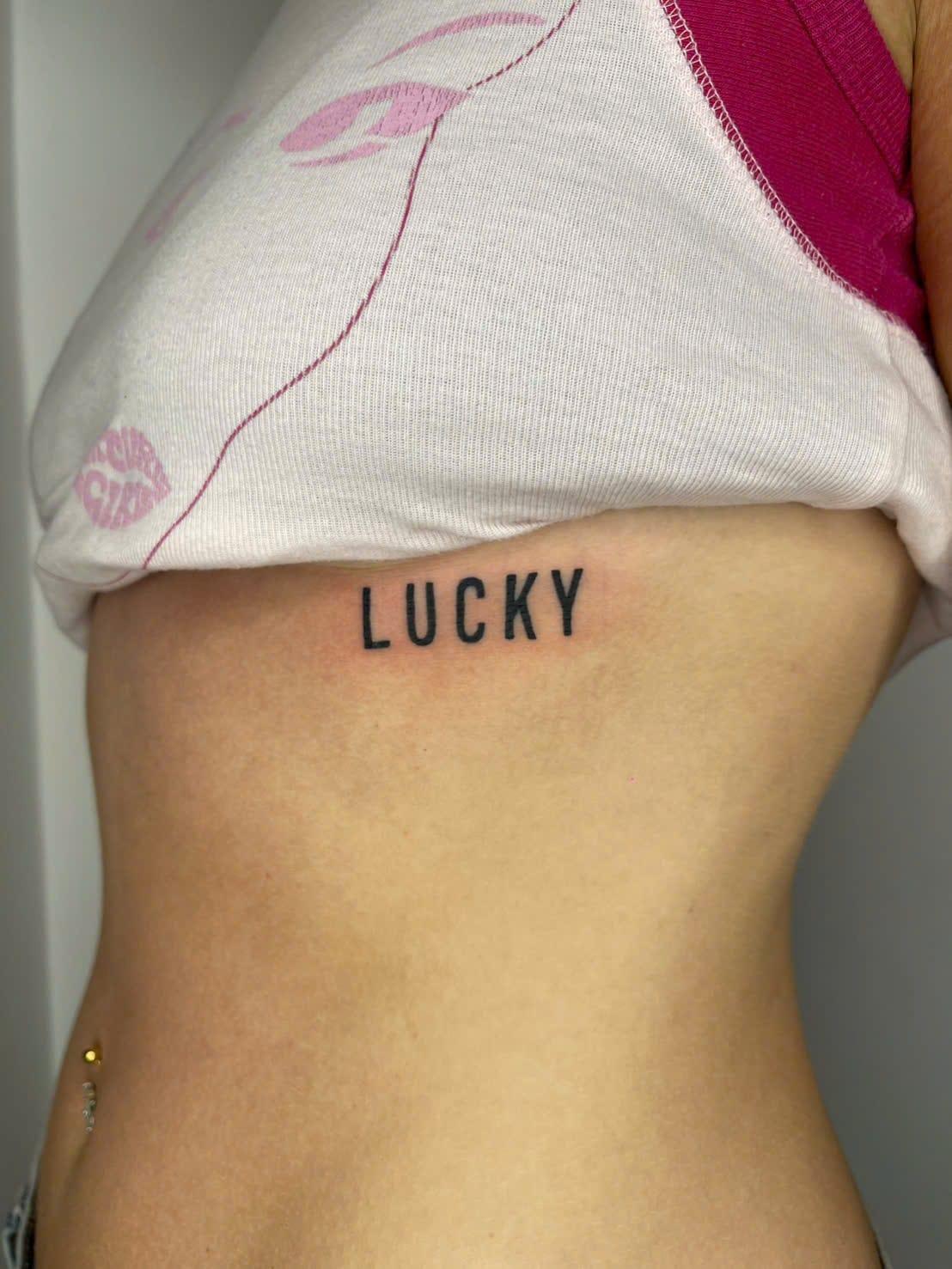 Bold lettering ribs tattoo — Rae Ink Saigon