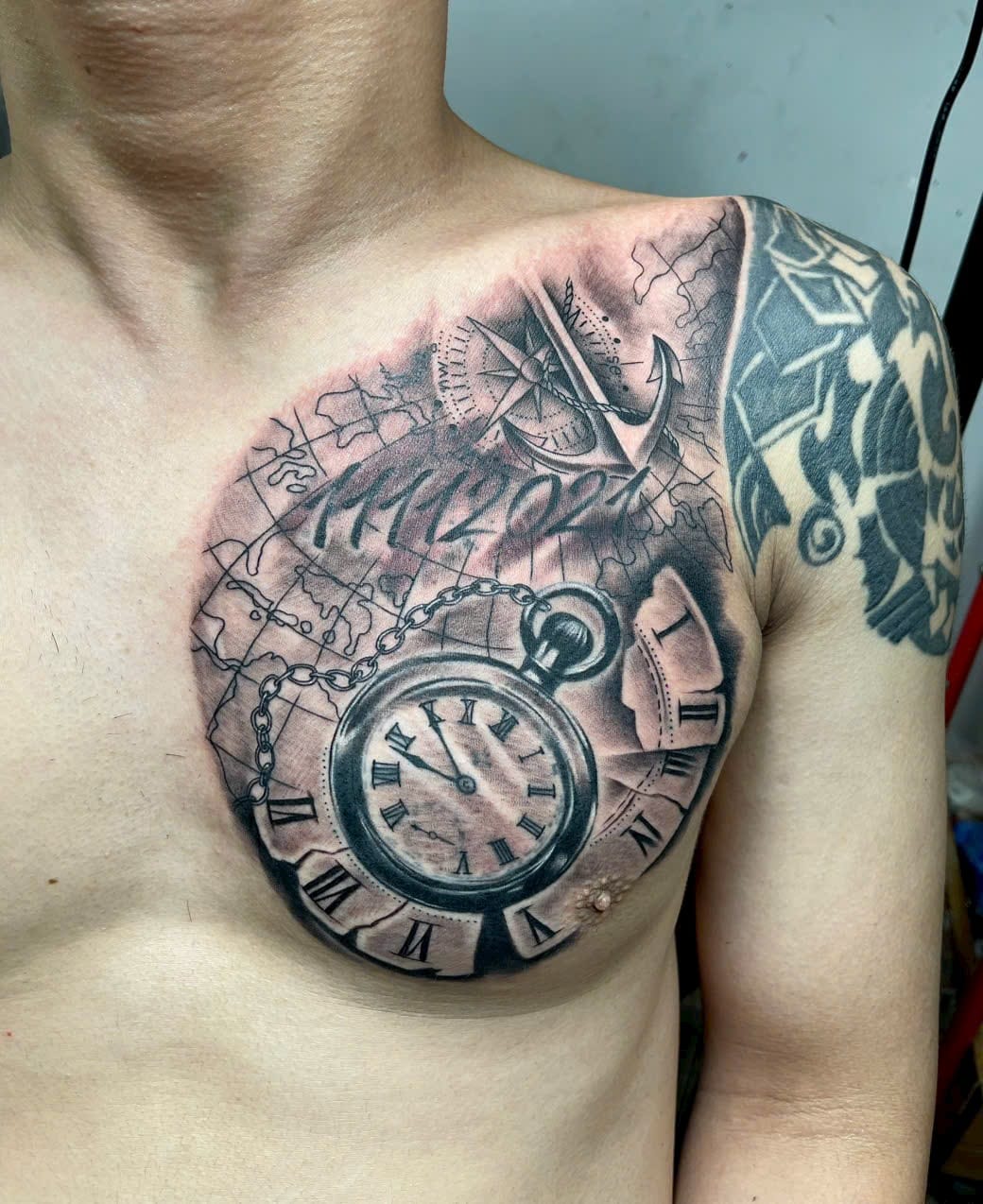 Pocket watch, world map and compass chest tattoo — Rae Ink Saigon